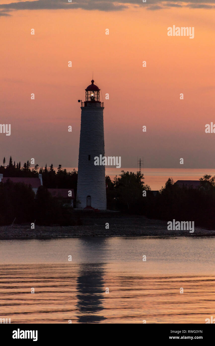 Cove island lighthouse w beacon on at dusk hires stock photography and