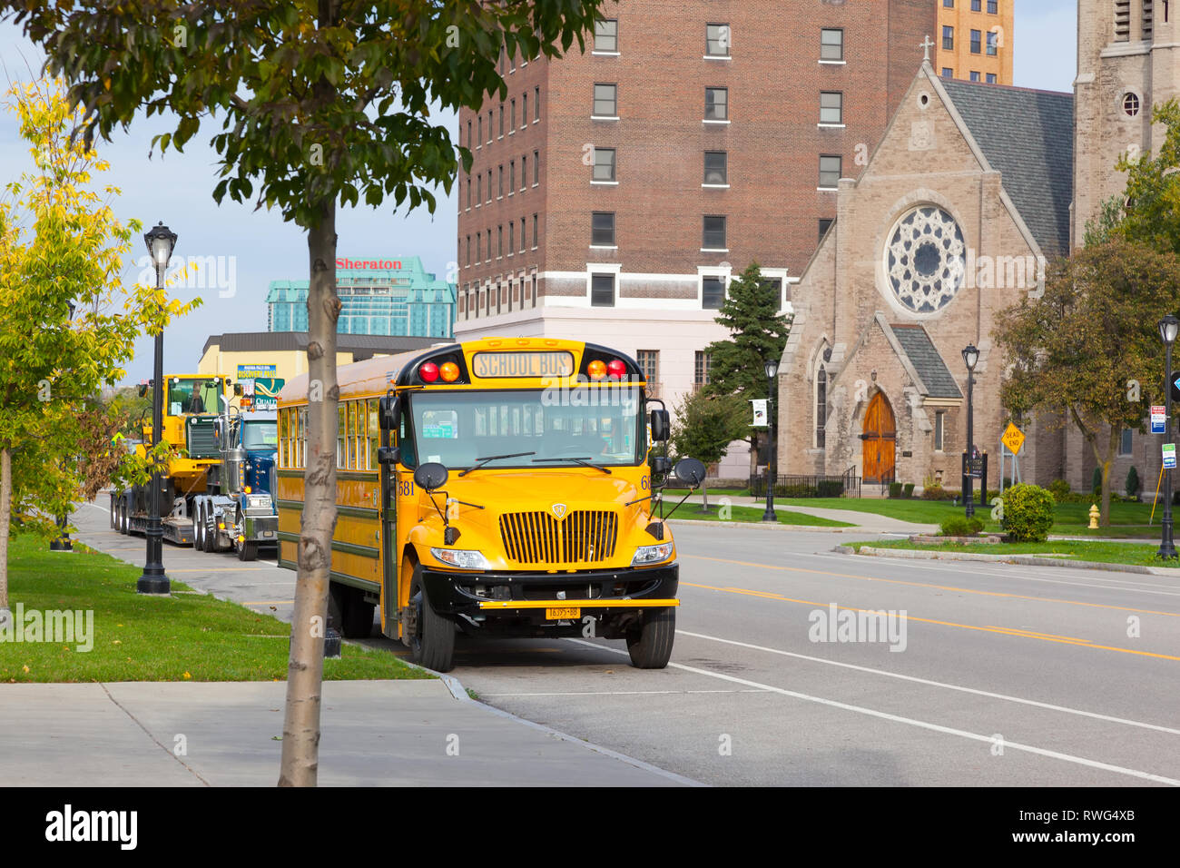 Yellow school bus in the street in town  Buffalo. Frontal view. Stock Photo