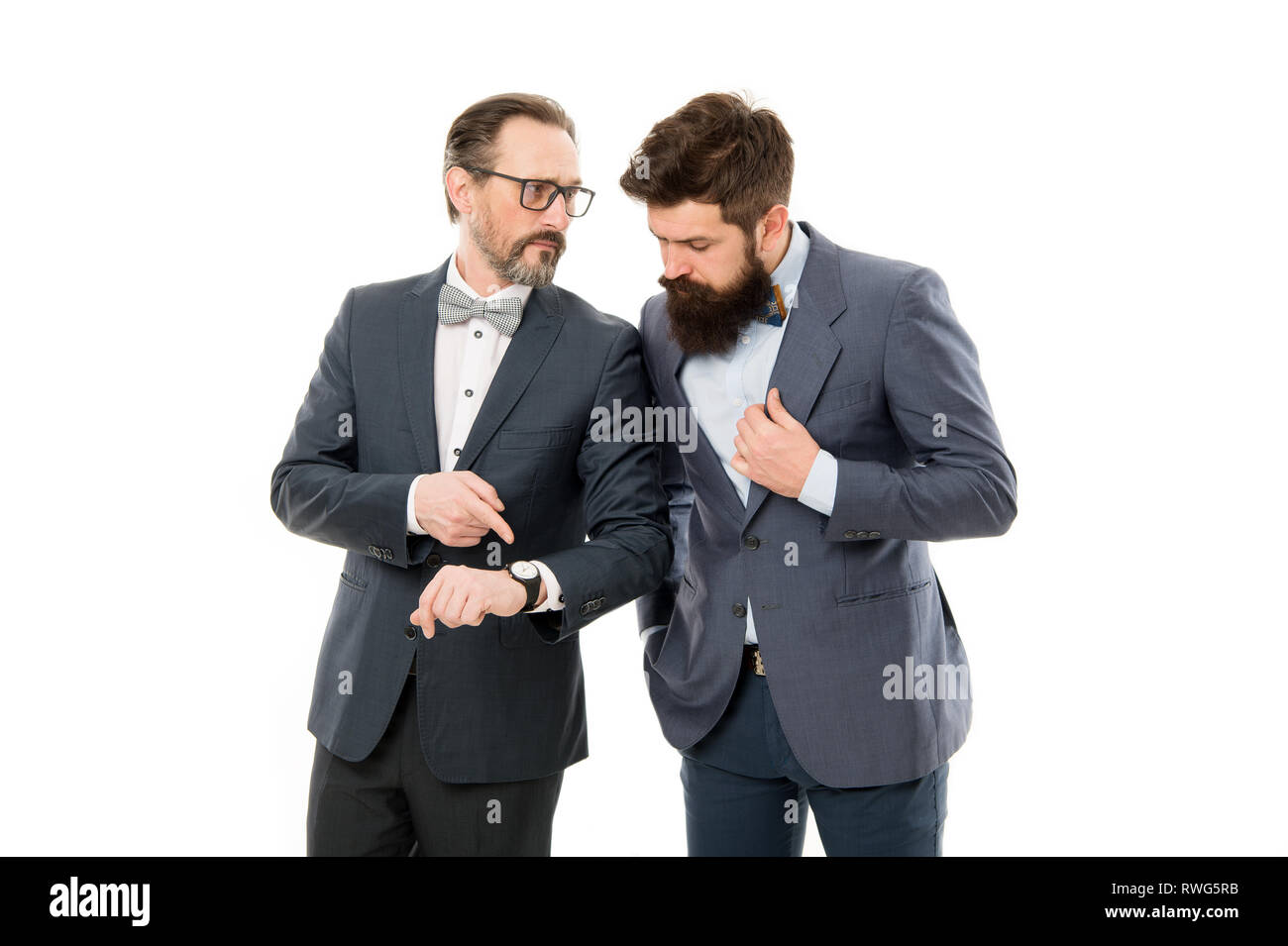Check clock. Business people formal clothes having different opinion about time. Time management and discipline. Improve punctuality. Man mature experienced with clock care about time efficiency. Stock Photo