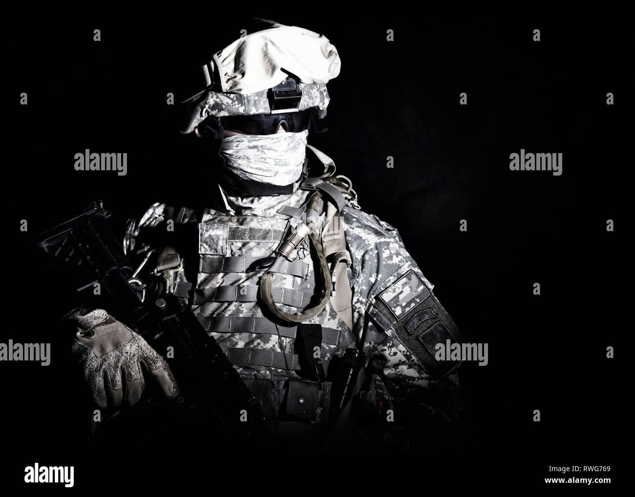 Portrait of an armed infantry soldier with face obscured, black ...