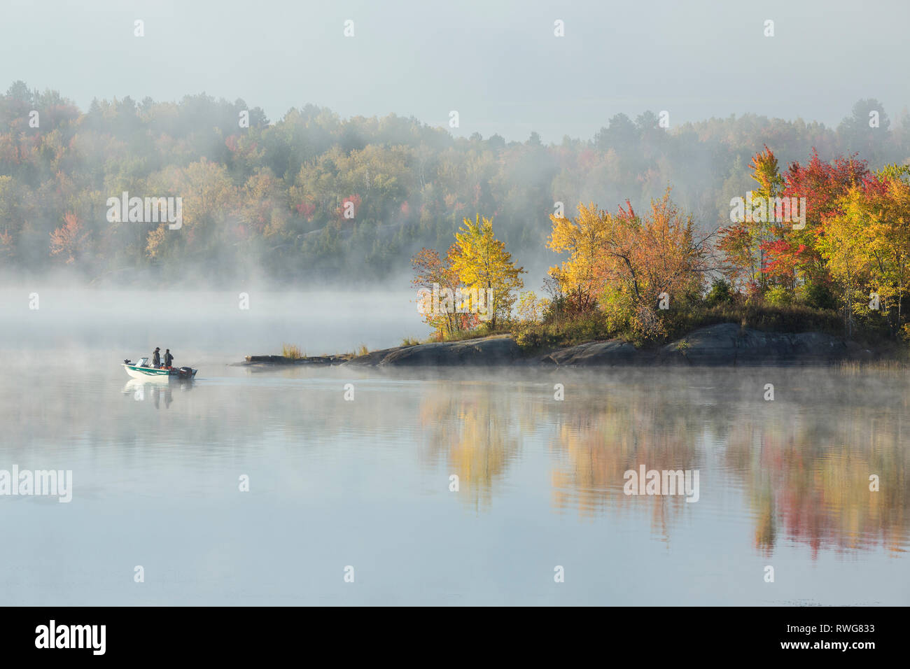 Fishermen on foggy autumn morning, Vermilion River, Whitefish, City of Greater, Sudbury, Ontario Stock Photo