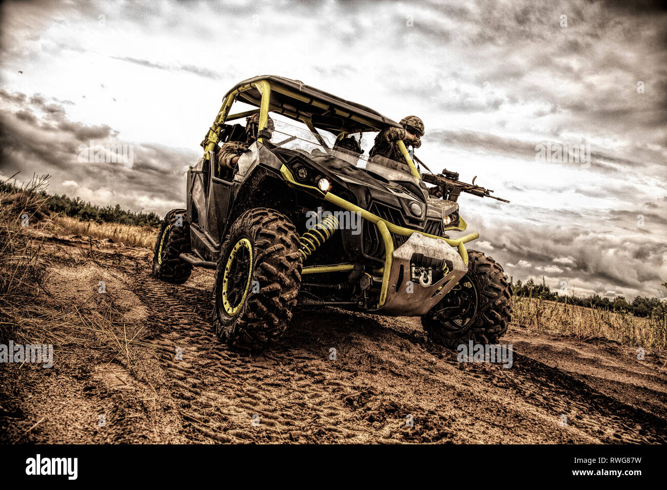 Mobile infantry team on patrol in an off-road military buggy. Stock Photo