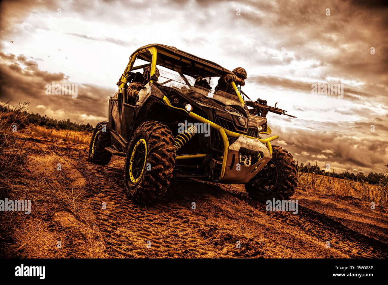 Mobile infantry team on patrol in an off-road military buggy. Stock Photo