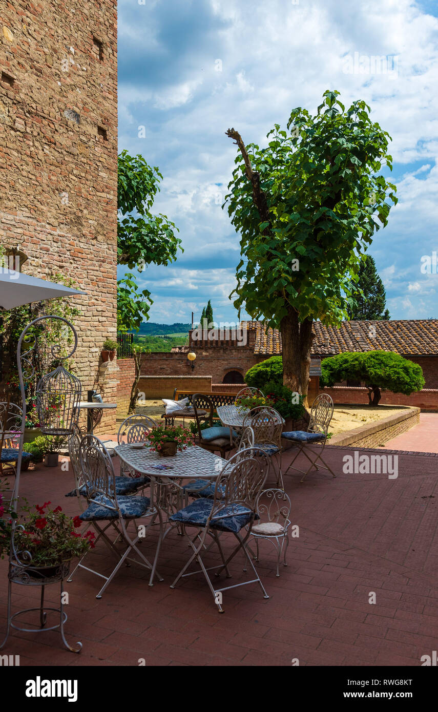 CERALDO, TUSCANY / ITALY, JUNE 20 2018: An outdoor cafe in the birthplace of Giovanni Boccaccio, author of Decameron, a medieval collection of tales s Stock Photo