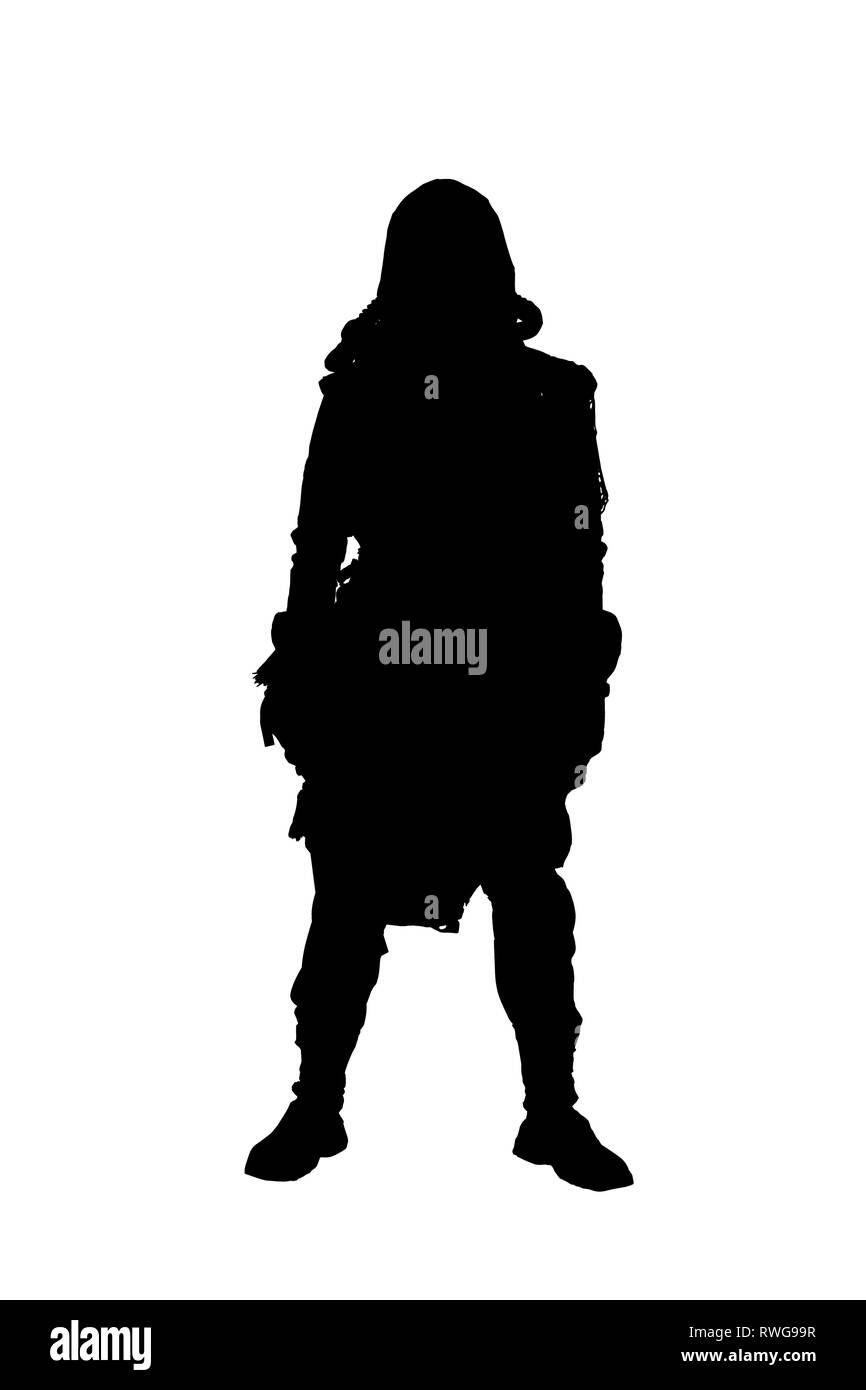 Terrifying post apocalyptic creature dressed in tattered rags and full-face gas mask. Stock Photo