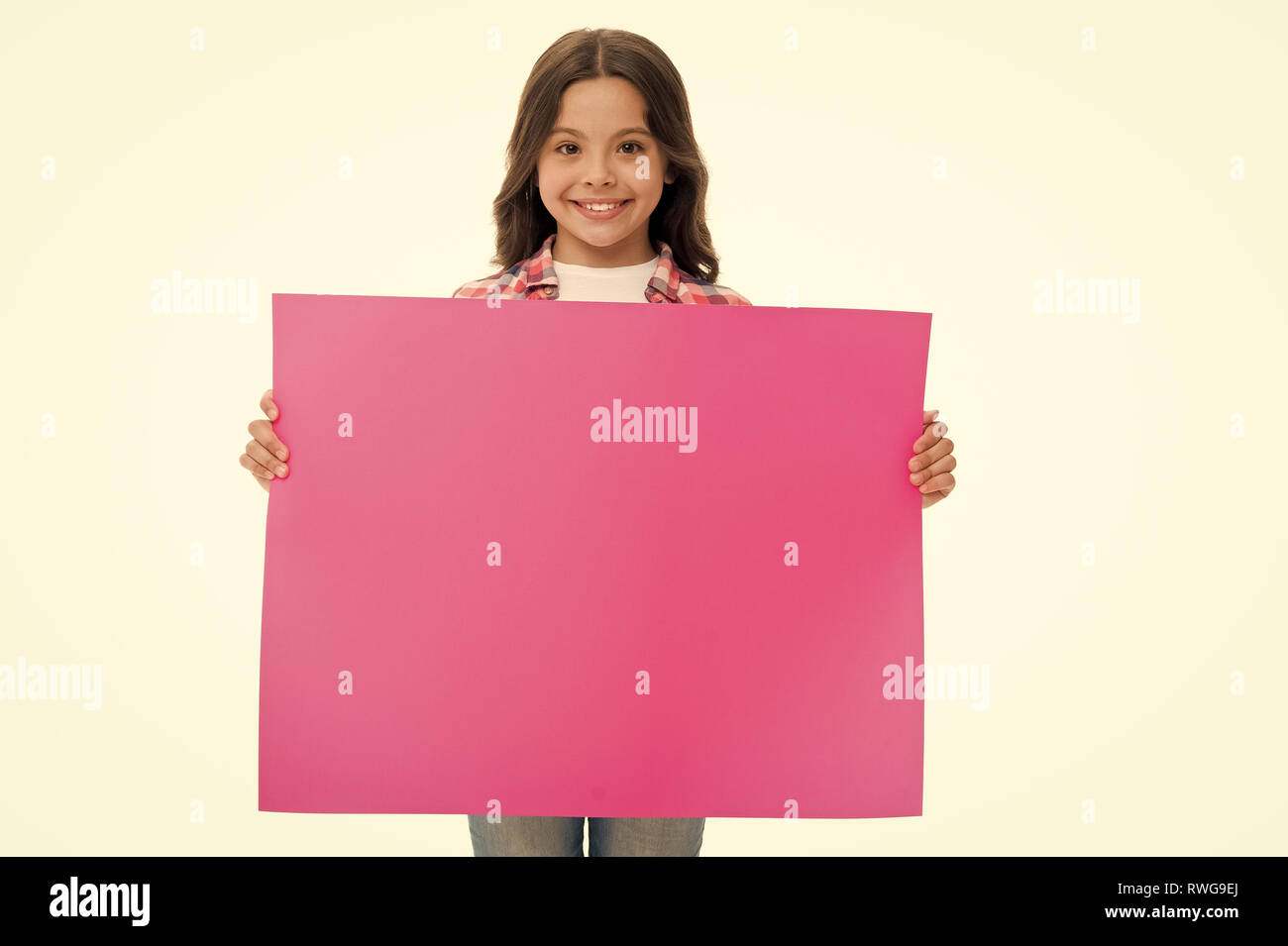 advertisement. little girl hold paper for advertisement. advertisement child with place for copy space. advertisement and presenting product concept. yout advertising here. Stock Photo