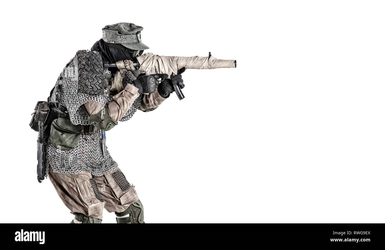 Post apocalyptic soldier wearing handmade armor, aiming submachine gun ...