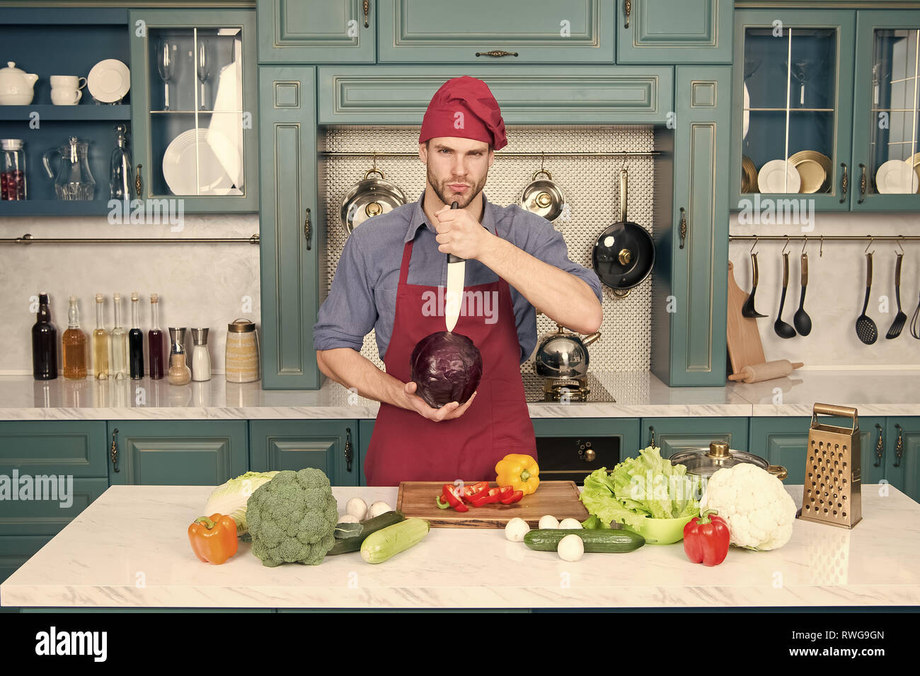Professional cook. Chef teaches how quickly chop vegetables. Chop food
