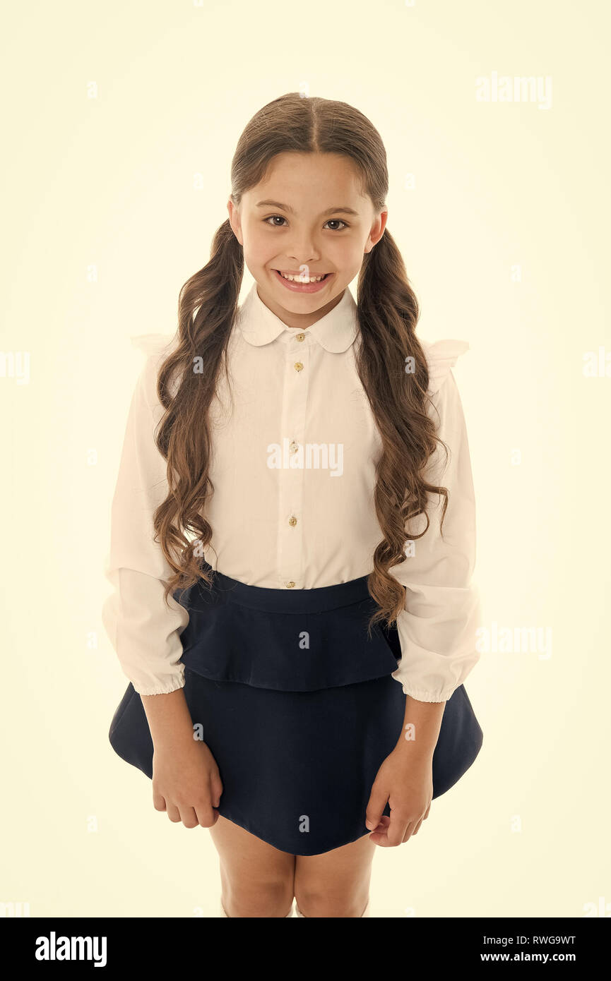 Cute and stylish. Gorgeous tails perfect for every day of week. Cute  everyday back to school hairstyles. Schoolgirl happy smiling pupil long  curly hair. Hairstyle for schoolgirl nice and easy Stock Photo -