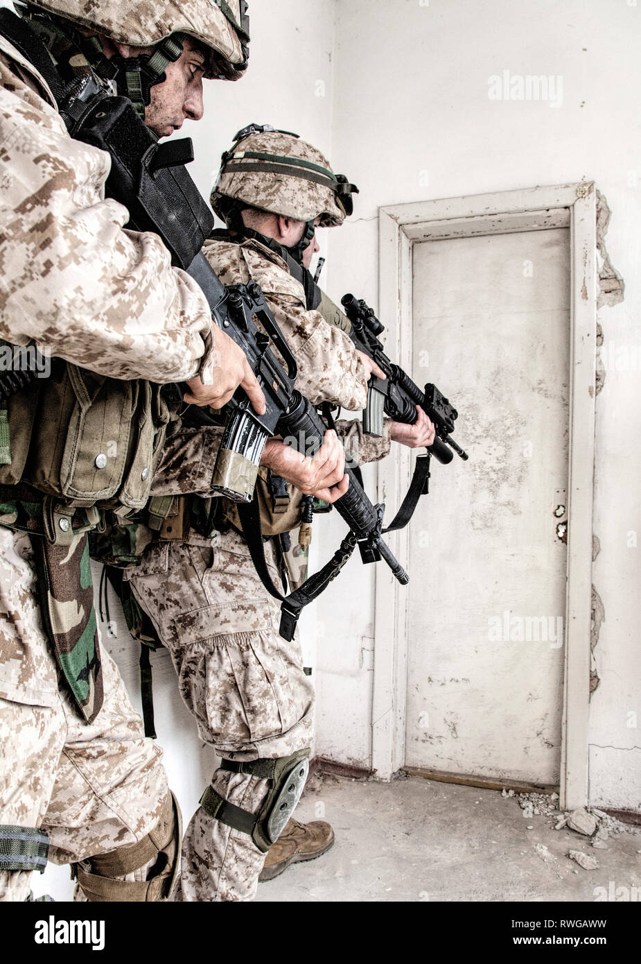 Marine assault team clearing rooms in an abandoned building Stock Photo ...