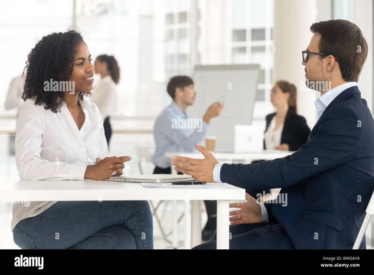 Multiracial businesspeople working together in shared office Stock Photo