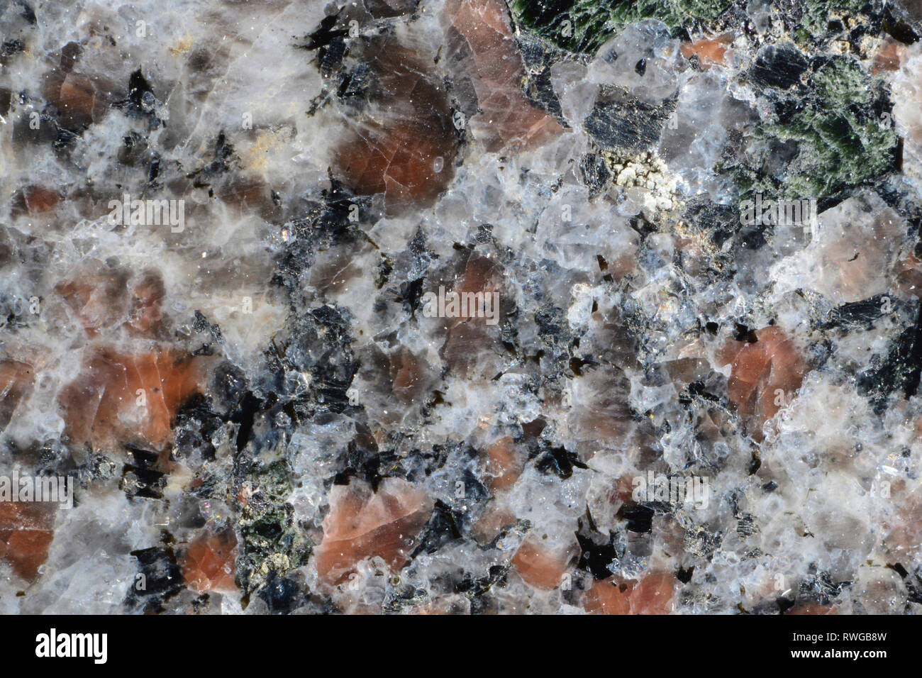Granite. Closeup of the structure. Crystals (feldspar, quartz, mica