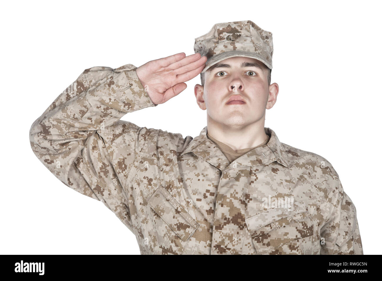 Studio portrait of U.S. soldier in combat uniform and patrol cap giving ...