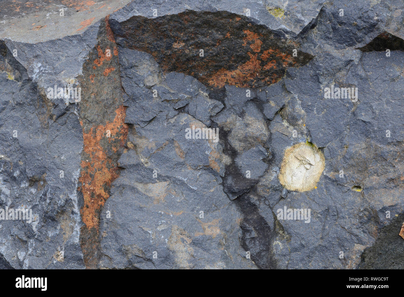 The basalt pit Bauersberg. Rhoen, Bavaria, Germany. Basalt rock of blue-gray color with characteristic stress cracks Stock Photo