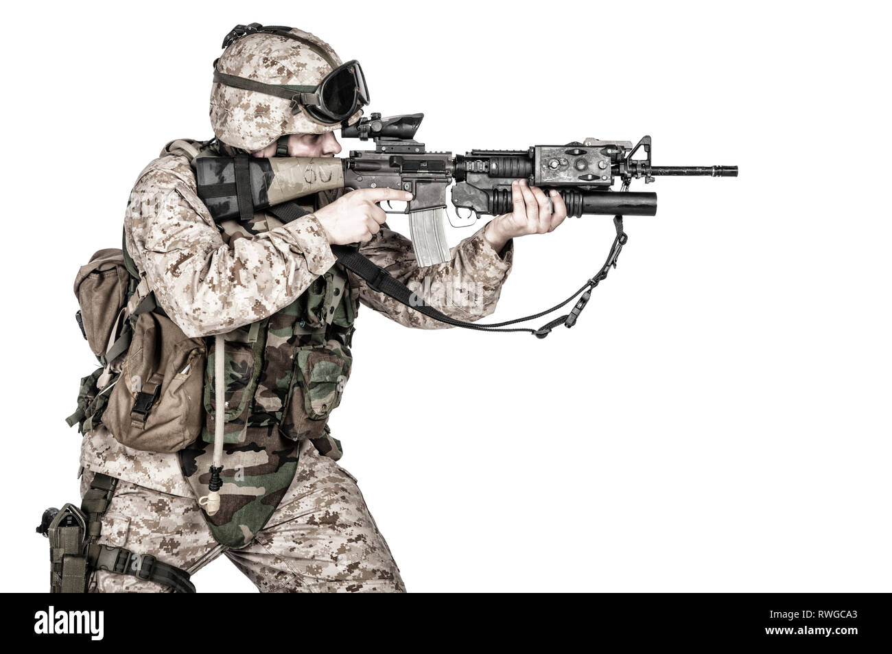 Studio shot of soldier with machine gun, isolated on white background. Stock Photo