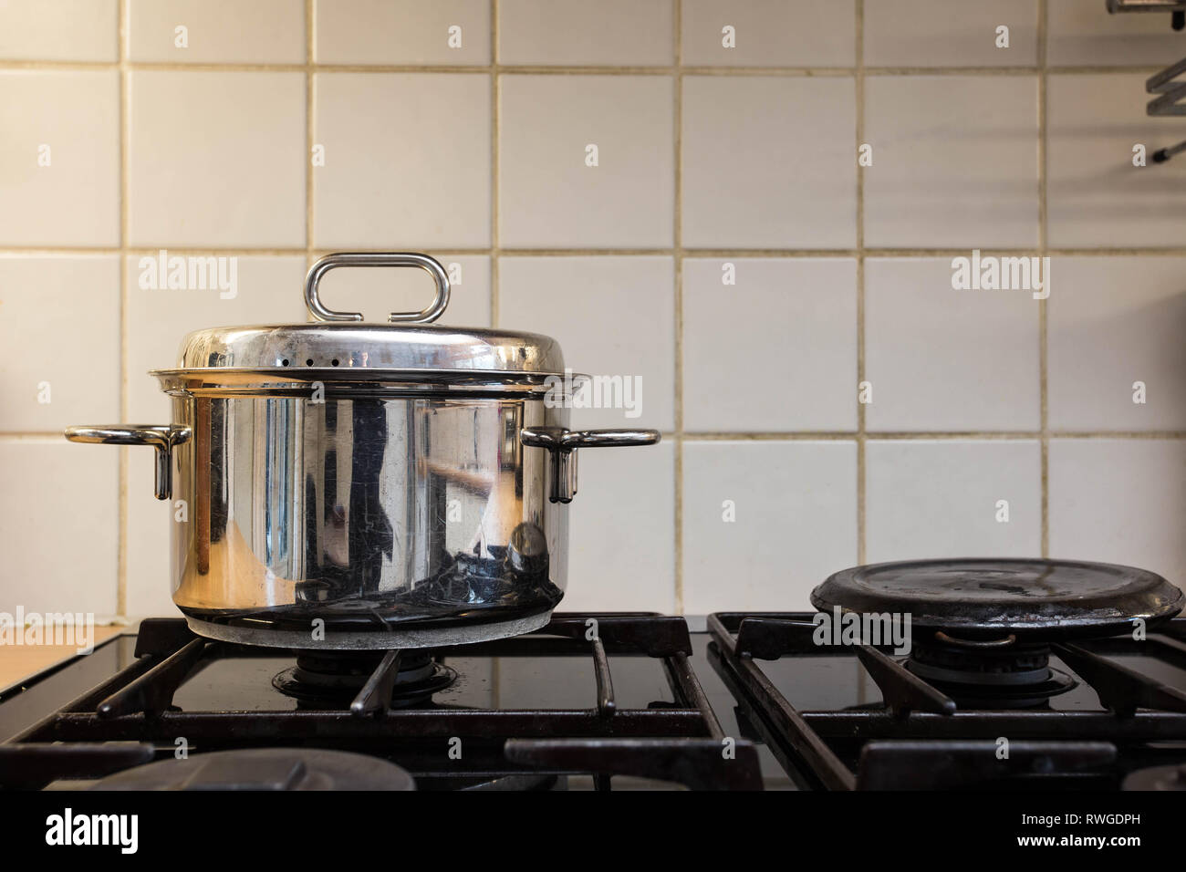 cooking pan on the gas stove, old design Stock Photo Alamy