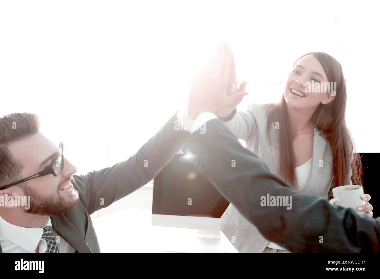 business team giving each other a high five Stock Photo - Alamy