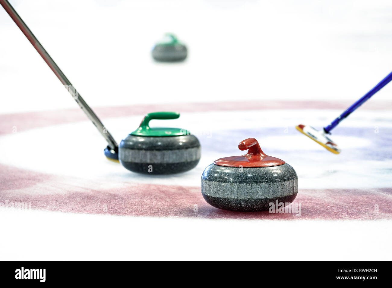 Curling stones equipment on the ice in closeup Stock Photo Alamy