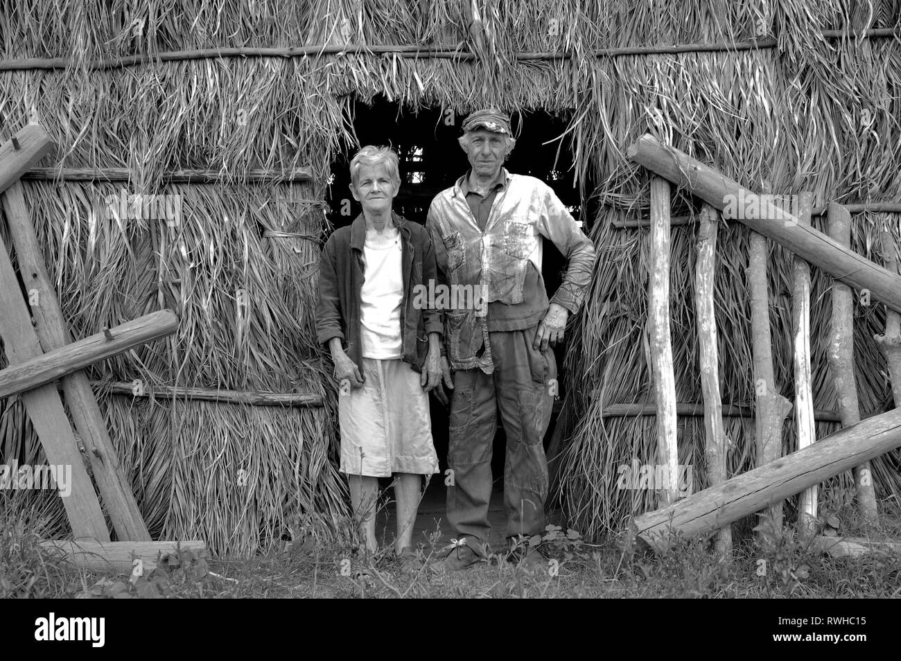 Vinales, Cuba- April 03,2003: Farmer couple posing in front of their drying shed in the Vinales Valley of Cuba Stock Photo