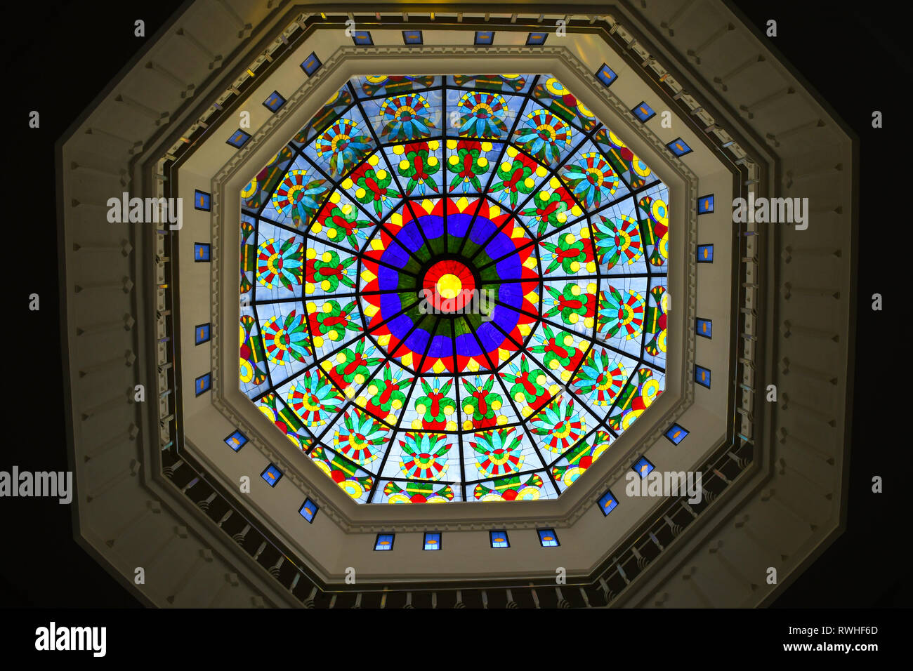 Colorful glass ceiling window inside big cathedral church Stock Photo