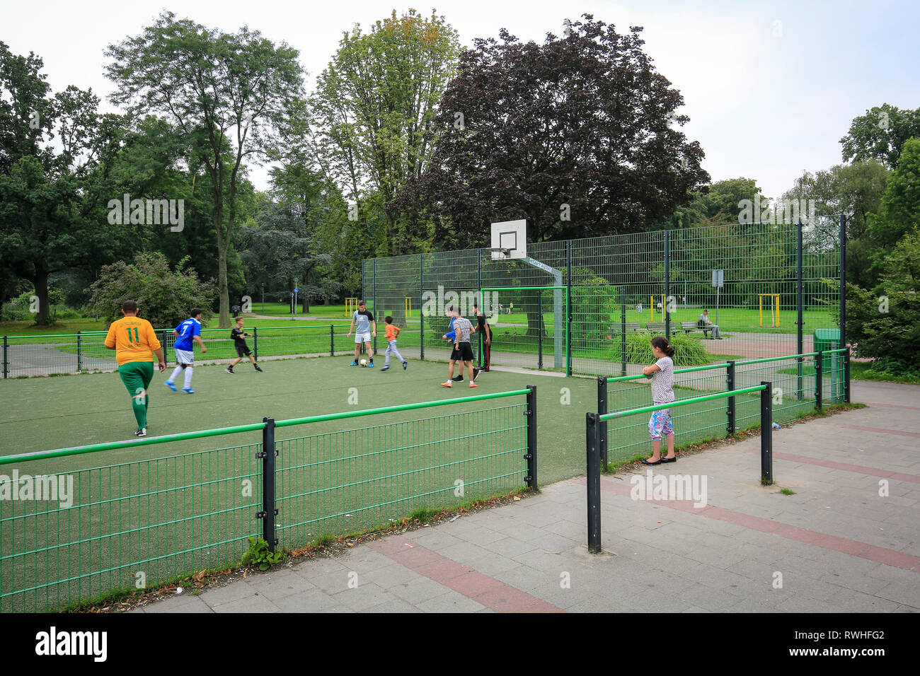 Essen, North Rhine-Westphalia, Ruhr area, Germany - young people play football on the football field in the Kaiser Wilhelm Park in Altenessen, here on Stock Photo