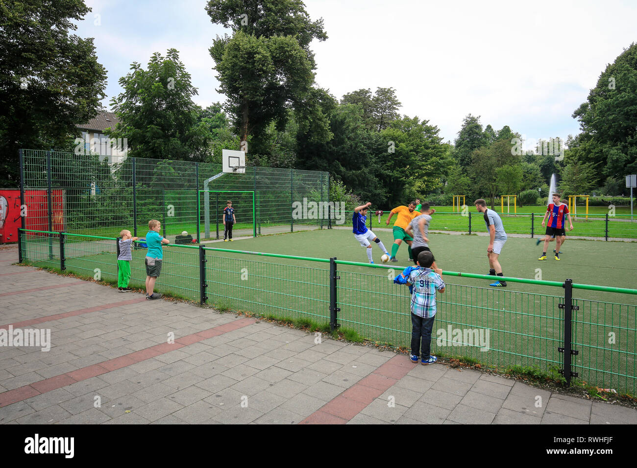 Essen, North Rhine-Westphalia, Ruhr area, Germany - young people play football on the football field in the Kaiser Wilhelm Park in Altenessen, here on Stock Photo