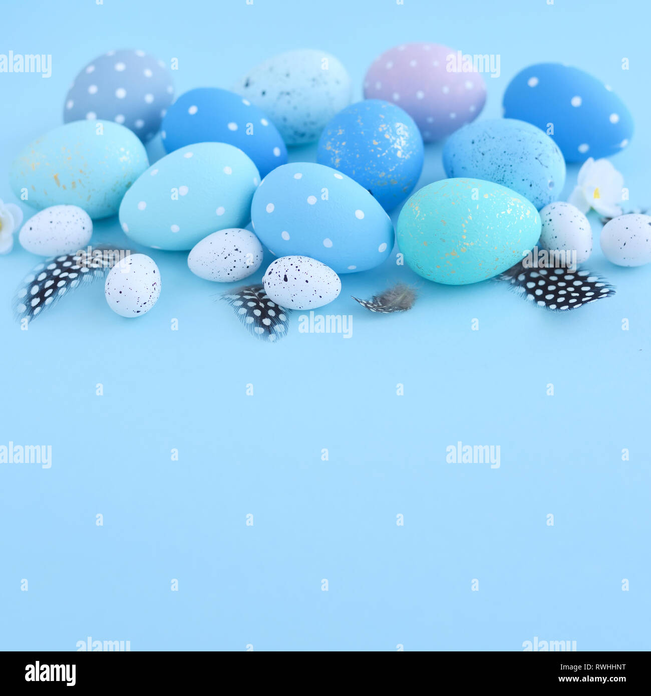 Easter eggs on blue background with empty space. Easter card Stock Photo