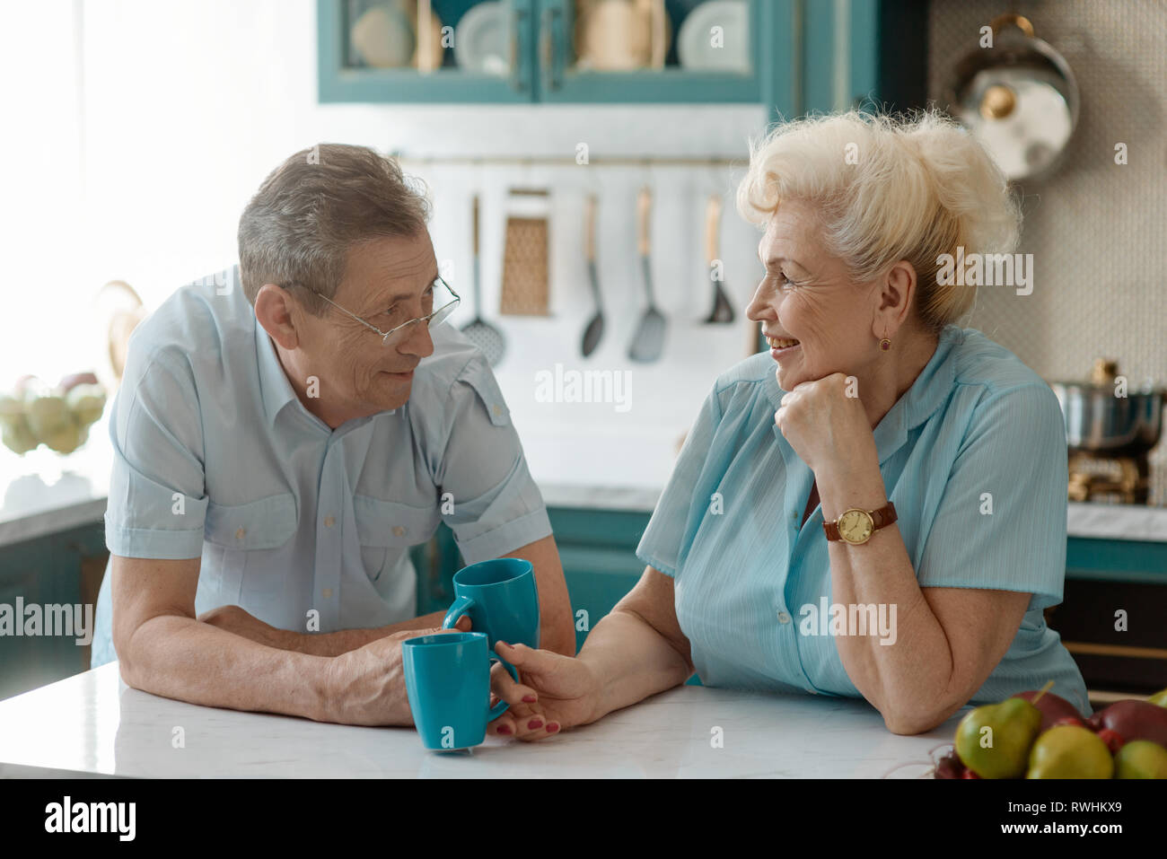 Grandparents drinking tea and talking Stock Photo