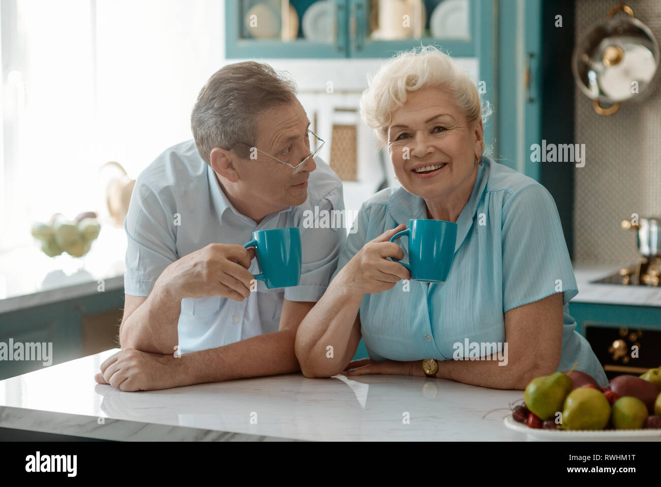 Happy grandparents drinking tea together Stock Photo