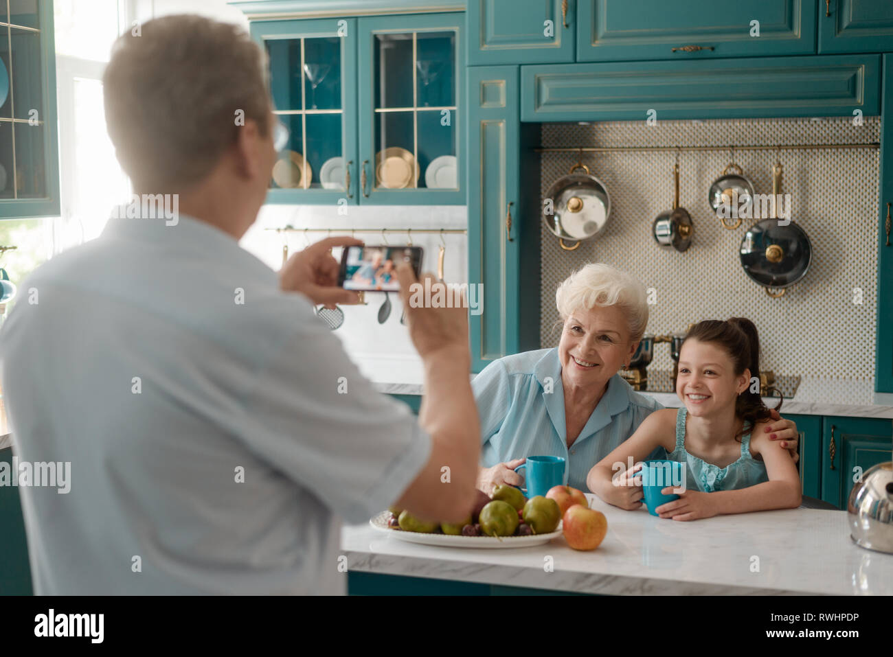 Grandfather taking a picture Stock Photo