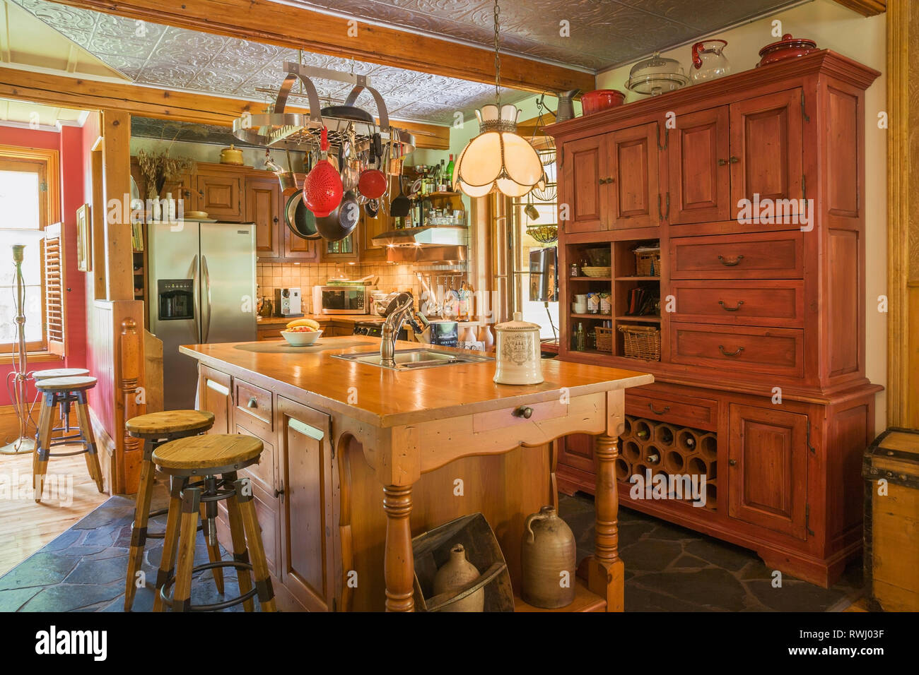 Kitchen With Pinewood Island Buffet Cabinets Slate Floor