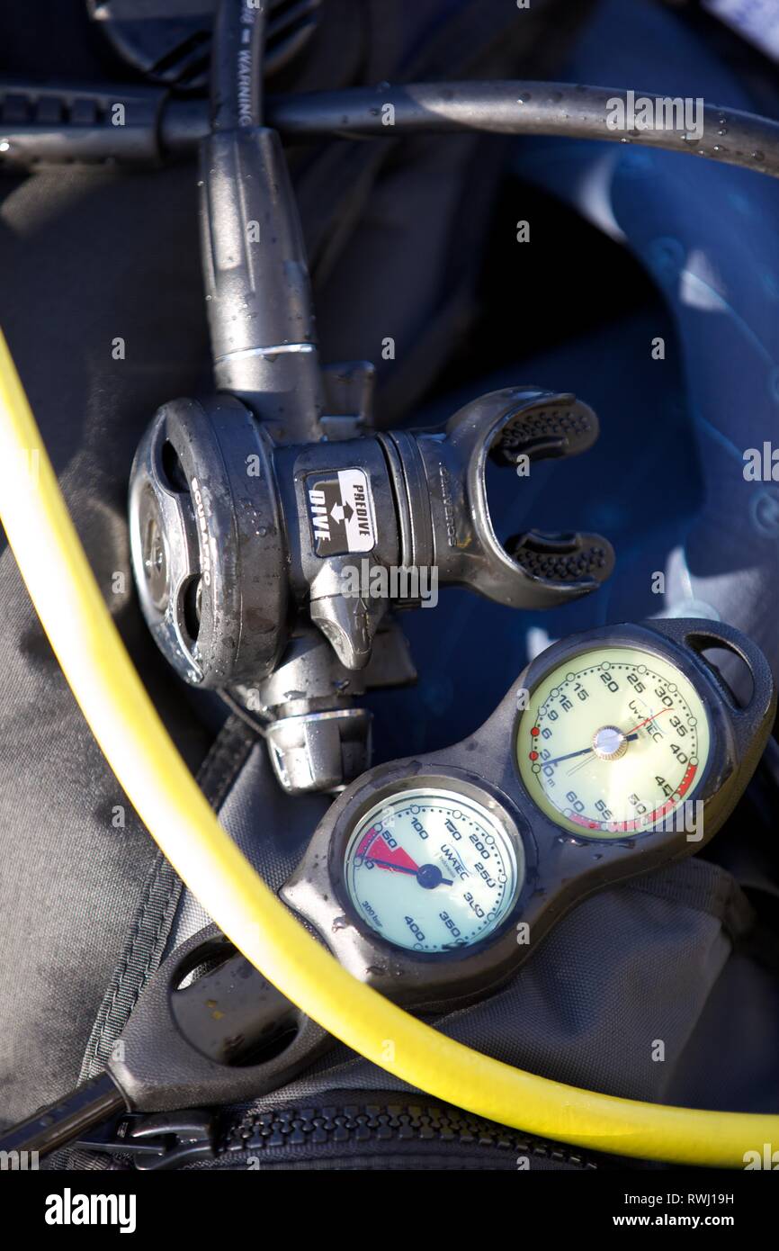 Extreme close up of Diving breathing apparatus and oxygen gauge on deck Stock Photo