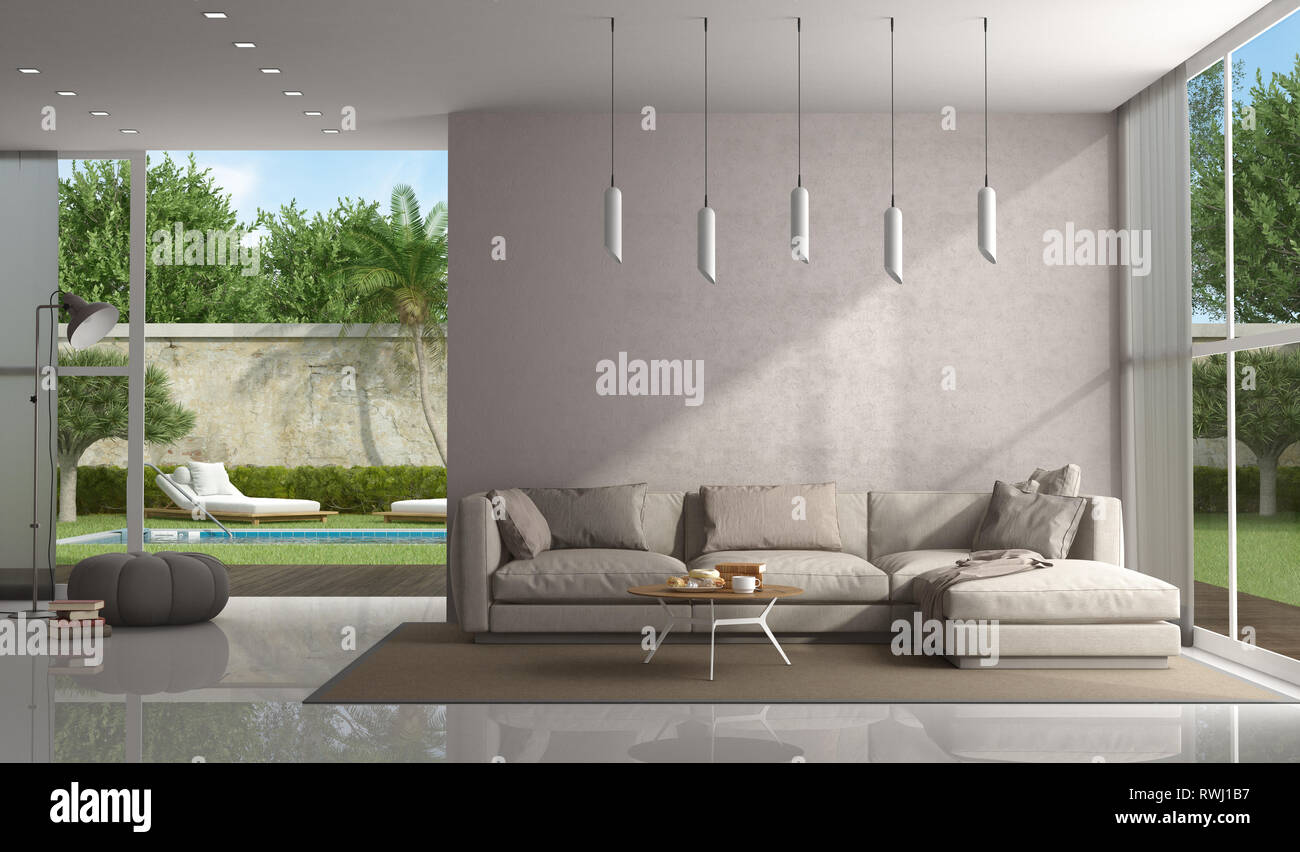Brown living room of a modern villa with pool on background - 3d rendering Stock Photo