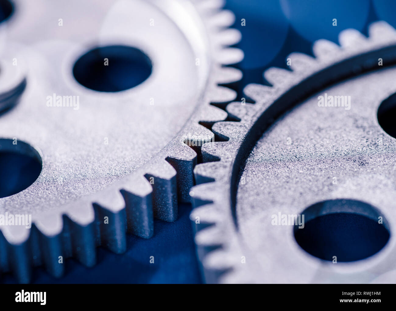 Detail of two gears meshing with each other. Stock Photo
