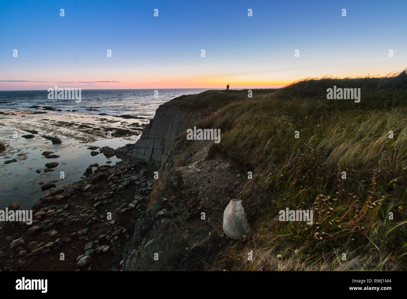 Sunset over the Gulf of St. Lawerence, Green Point, Gros Morne National Park, Newfoundland and Labrador Stock Photo