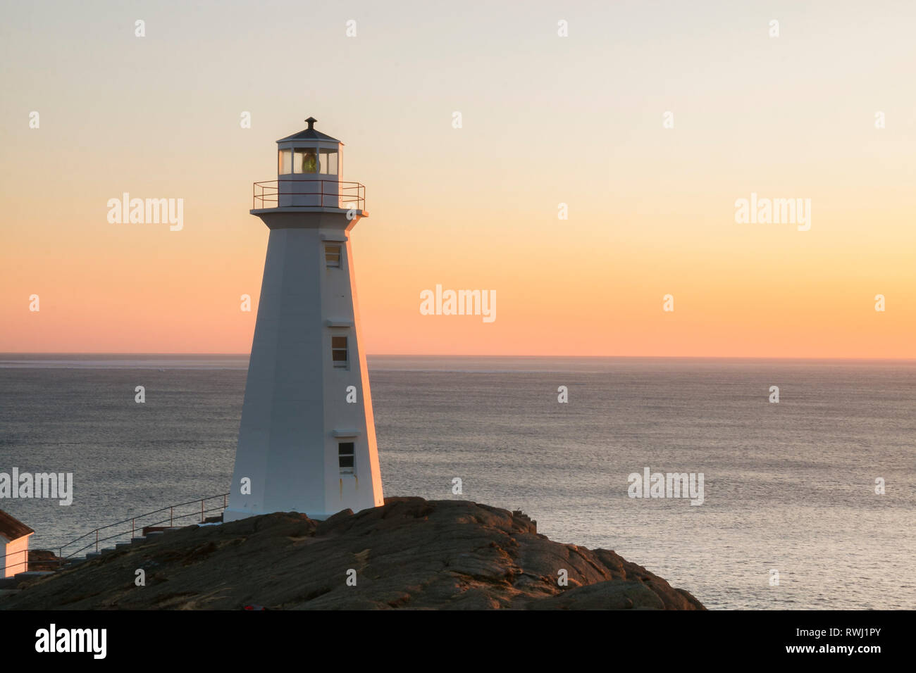Watching Sunrise.  Cape Spear Lighthouse National Historic Site,  the easternmost point in Canada, and North America. (52°37'W) St. John's, Newfoundland and Labrador Stock Photo