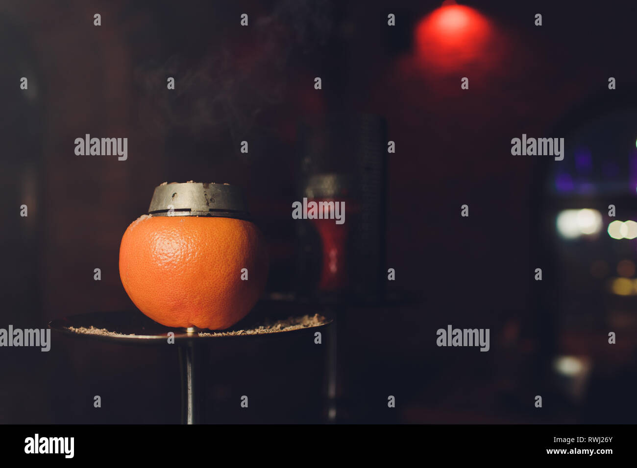 Luxury hookah with orange. Exotic bowl with fruit. Hookah lounge