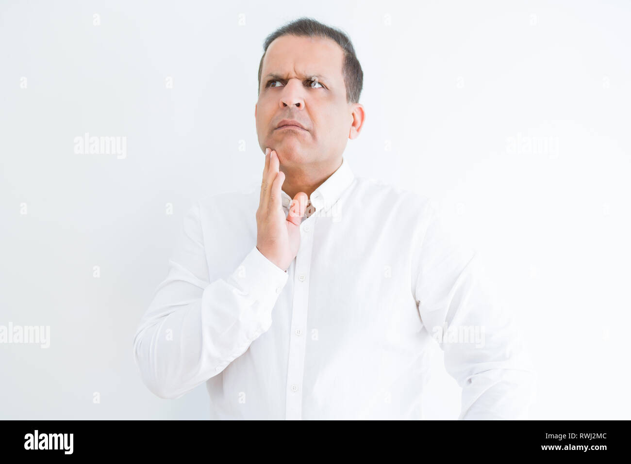 Middle age man thinking clueless about a question Stock Photo