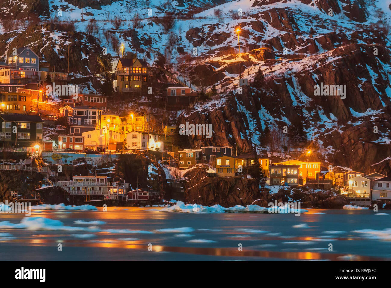 View of the fishing Village the Battery, St John's, Newfoundland and Labrador, Pack ice drifting in the harbour narrows Stock Photo