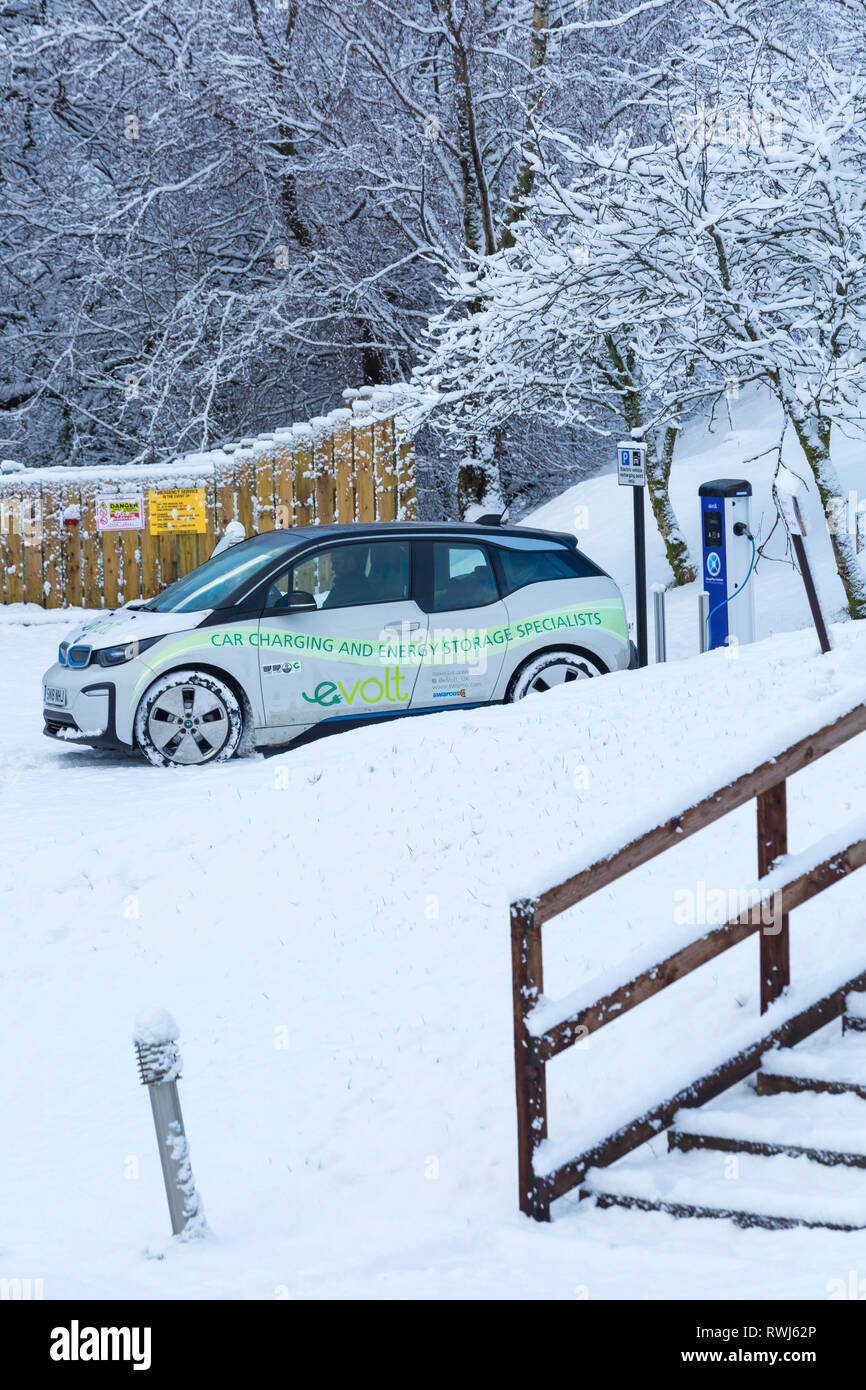 BMW Electric car being charged at electric car charging station point