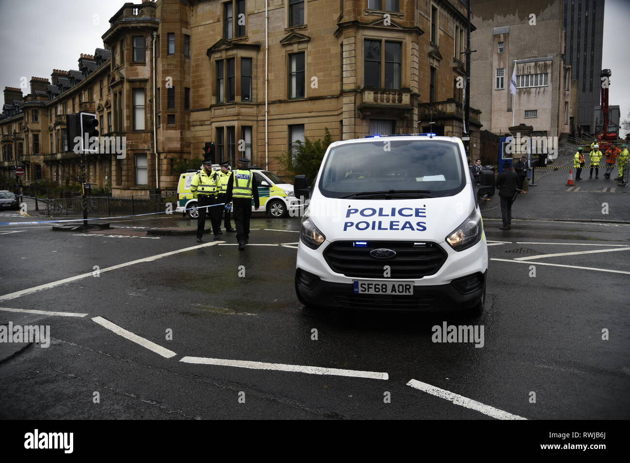 Glasgow, Glasgow City, UK. 6th Mar, 2019. A police van seen blocking the road at the scene to stop people from going through the cordon.Police have found a suspicious package at Glasgow University in Scotland. Police and Campus Staff have shut the area down for the time being. Credit: Stewart Kirby/SOPA Images/ZUMA Wire/Alamy Live News Stock Photo