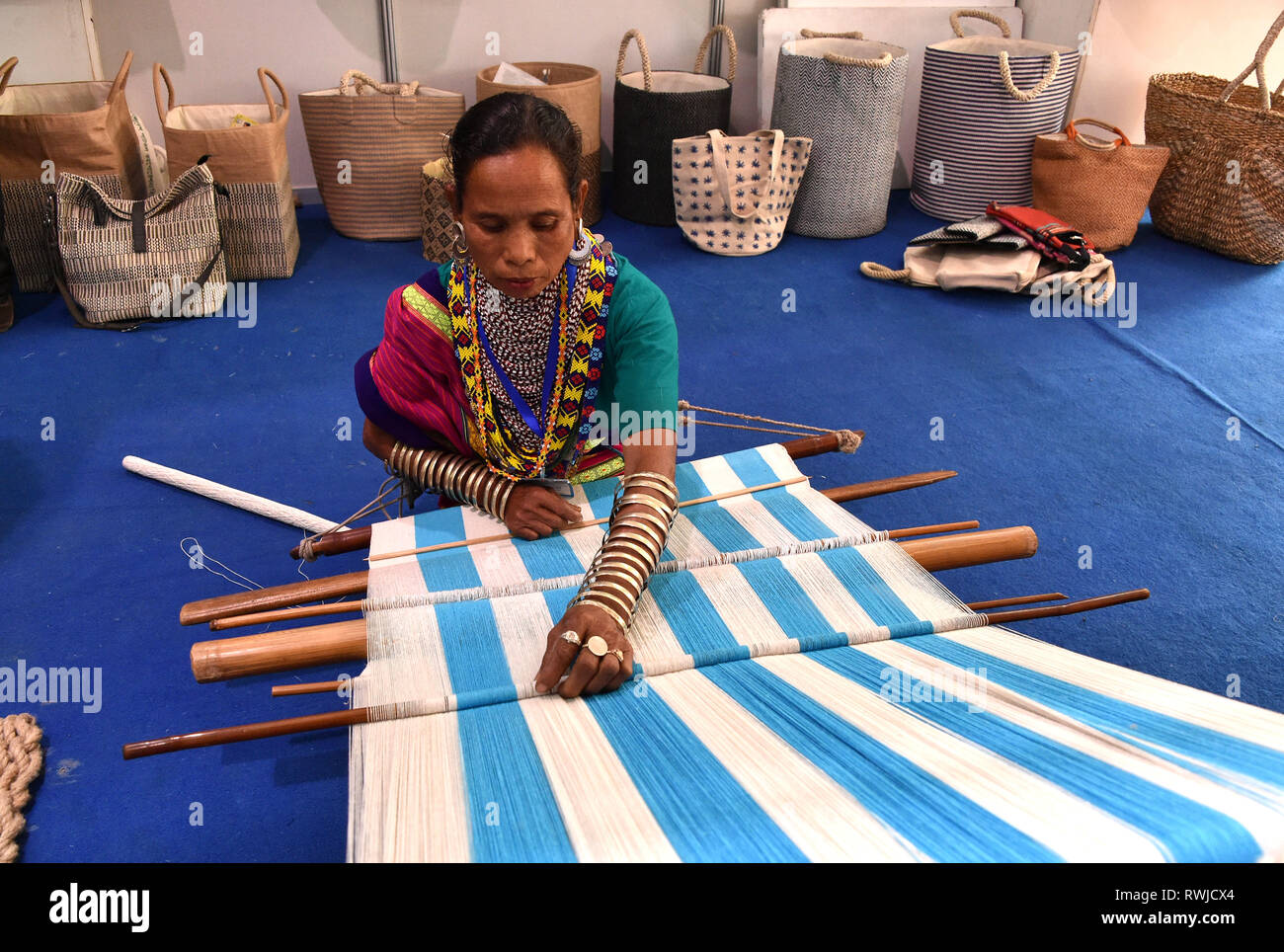 Dhaka. 6th Mar, 2019. A woman makes jute products during a jute fair in Dhaka, Bangladesh, on