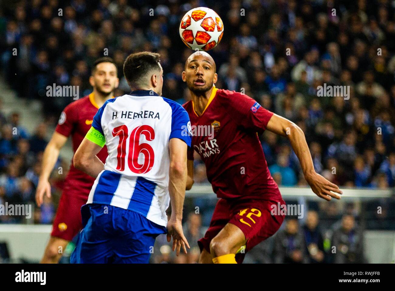 FC Porto's player Héctor Herrera (L) vies for the ball with AS Roma's player Steven Nzonzi (R) during the match against AS Roma for the UEFA Champions League round 16th 2nd leg at Dragon Stadium in Porto. Final Score: FC Porto 3-1 AS Roma Stock Photo