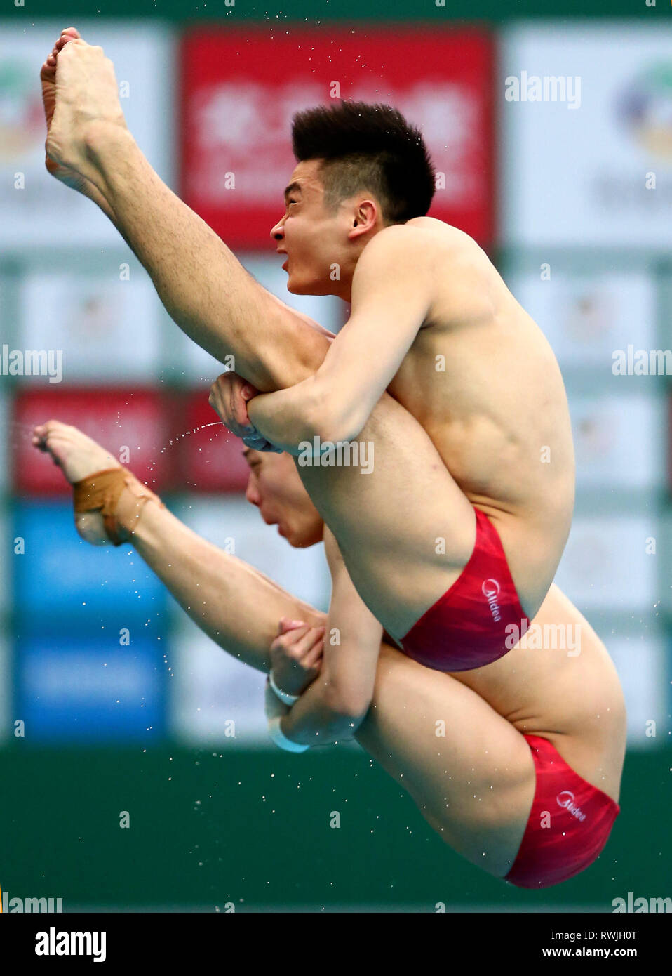Beijing, China. 7th Mar, 2019. Cao Yuan (Front) and Chen Aisen of China compete during the men's 10m Platform Synchro Final at the FINA Diving World Series 2019 at the National Aquatics Center (Water Cube) in Beijing, capital of China, March 7, 2019. Credit: Luo Yuan/Xinhua/Alamy Live News Stock Photo
