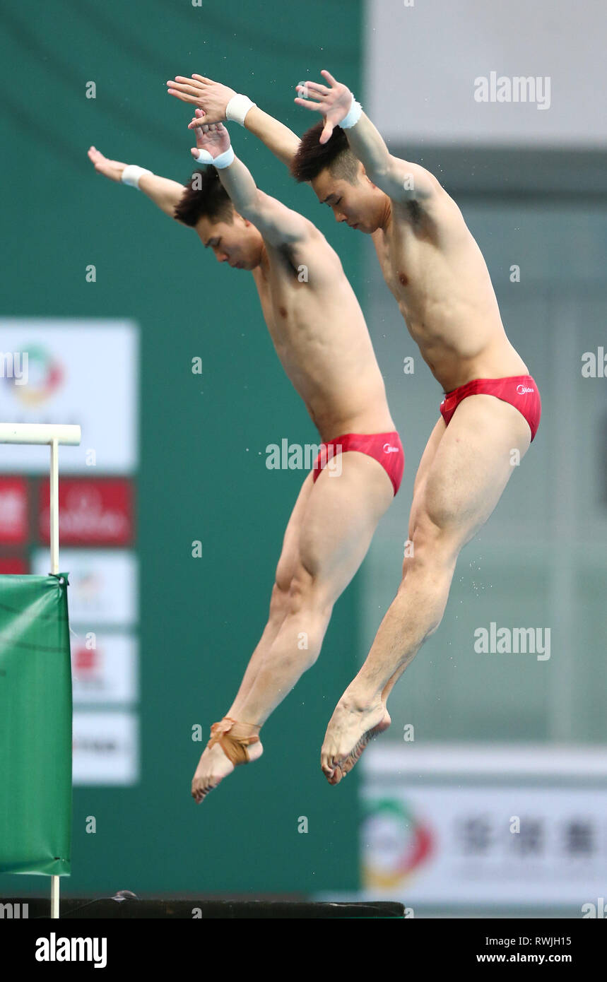 Beijing, China. 7th Mar, 2019. Cao Yuan (R) and Chen Aisen of China compete during the men's 10m Platform Synchro Final at the FINA Diving World Series 2019 at the National Aquatics Center (Water Cube) in Beijing, capital of China, March 7, 2019. Credit: Luo Yuan/Xinhua/Alamy Live News Stock Photo