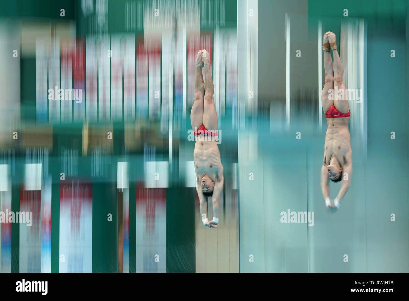 Beijing, China. 7th Mar, 2019. Cao Yuan (L) and Chen Aisen of China compete during the men's 10m Platform Synchro Final at the FINA Diving World Series 2019 at the National Aquatics Center (Water Cube) in Beijing, capital of China, March 7, 2019. Credit: Ju Huanzong/Xinhua/Alamy Live News Stock Photo