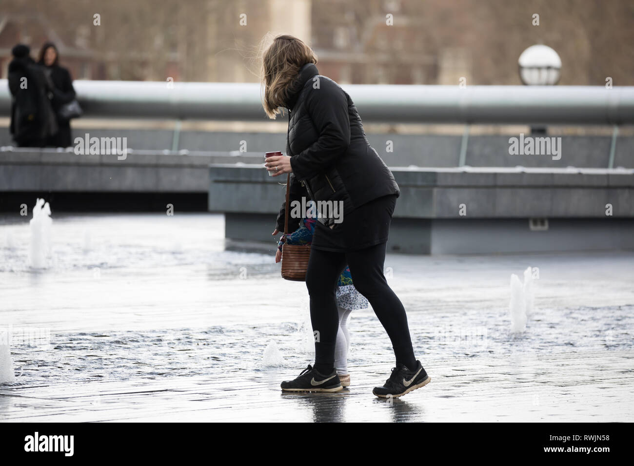 London, UK. 7th Mar, 2019. People walk along the Queenswalk in London enjoying the sunshine and River views. Strong winds are forecast for this afternoon in London again. Credit: Keith Larby/Alamy Live News Stock Photo