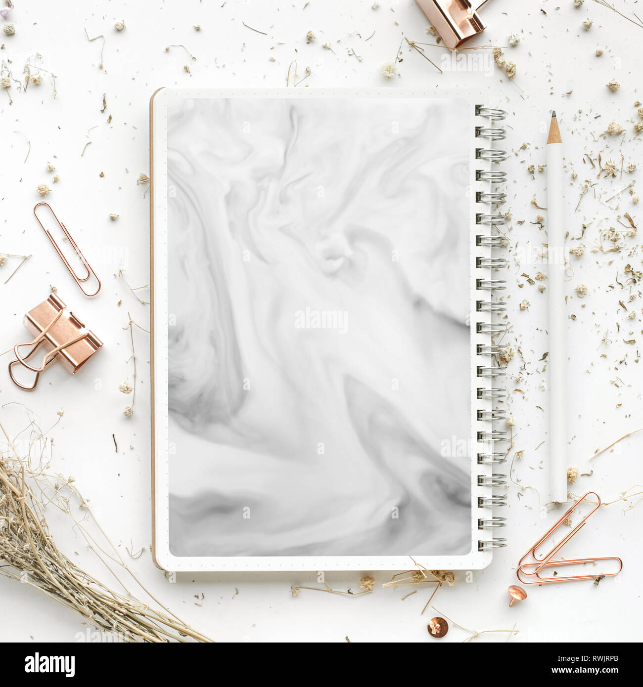 Top view of mock up accessories and dry flower on white desk table.flat lay design/copy space,elegant template Stock Photo