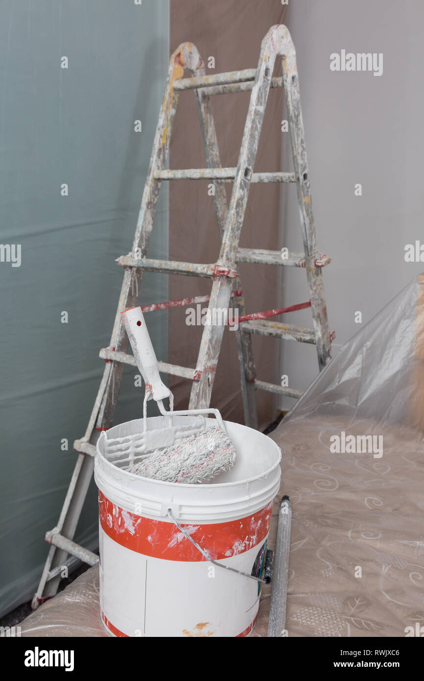Staircase and Tools for Painting and Furniture with Transparent Protective Sheeting. Stock Photo