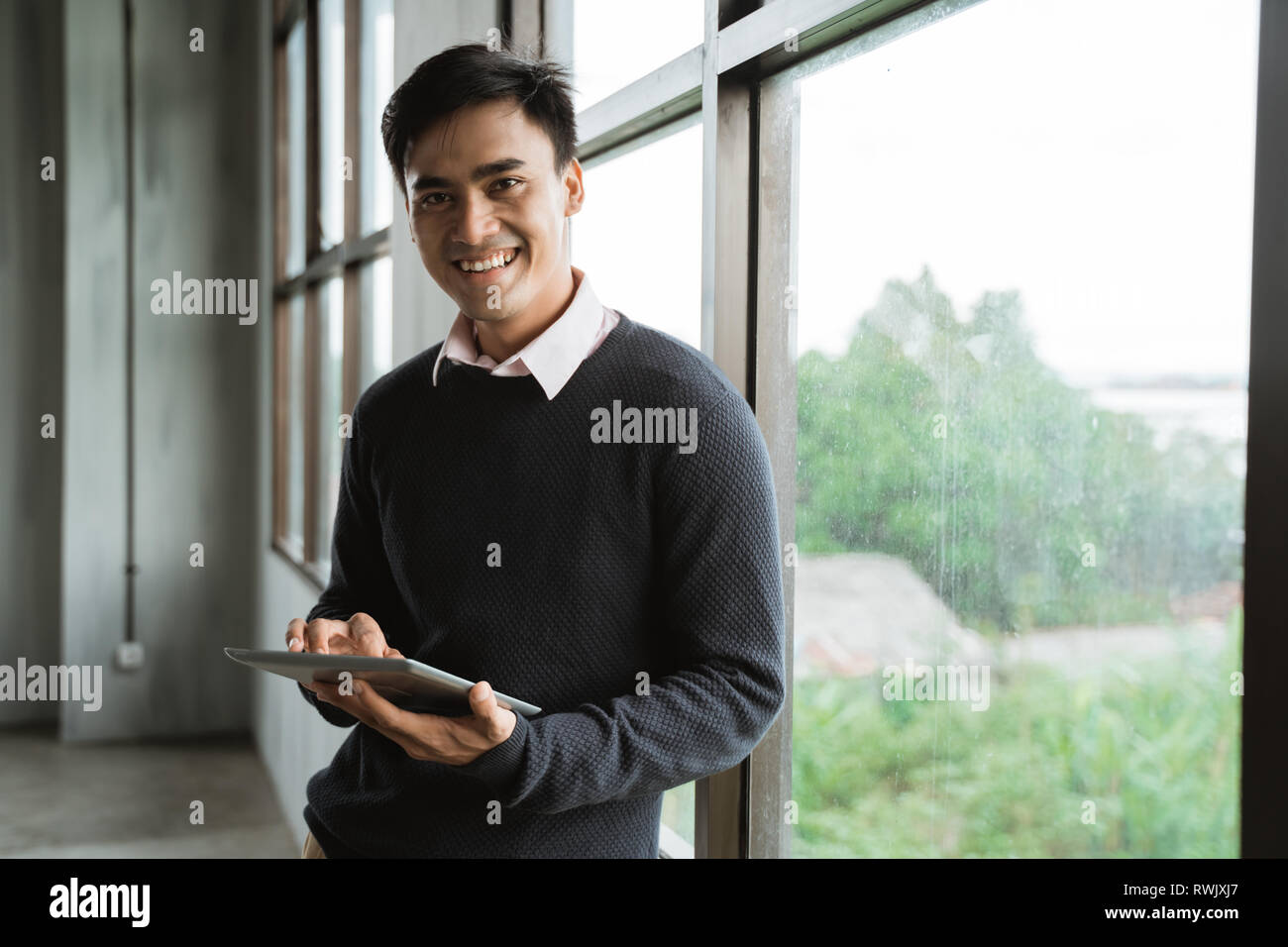 asian young businessman using tablet pc Stock Photo
